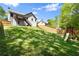 The backyard features a playset, grass, and a privacy fence at 208 Julia Lynn Ln, Acworth, GA 30102