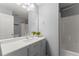 Bathroom with large mirror, modern vanity and hardware and walk-in shower at 208 Julia Lynn Ln, Acworth, GA 30102