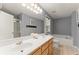 Bathroom with double sink vanity, soaking tub, and large mirror at 208 Julia Lynn Ln, Acworth, GA 30102
