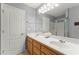 Bathroom with double vanity, large mirror, and walk-in shower at 208 Julia Lynn Ln, Acworth, GA 30102