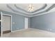 Bedroom featuring trey ceiling with crown molding, carpet floors, and natural light at 208 Julia Lynn Ln, Acworth, GA 30102