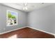 The bedroom has sleek floors and a bright window for natural light at 208 Julia Lynn Ln, Acworth, GA 30102