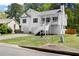 Charming home with a two-car garage and a stairway to the elevated front porch at 208 Julia Lynn Ln, Acworth, GA 30102