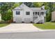 Charming home with a two-car garage and a stairway to the elevated front porch at 208 Julia Lynn Ln, Acworth, GA 30102
