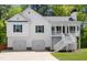 Charming home with a two-car garage and a inviting elevated front porch at 208 Julia Lynn Ln, Acworth, GA 30102