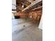 View of a spacious garage featuring unfinished walls and ample storage options at 208 Julia Lynn Ln, Acworth, GA 30102