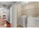 Bright laundry room features appliances and built in storage space at 208 Julia Lynn Ln, Acworth, GA 30102