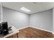 A simple office space with sleek wood floors and neutral walls at 208 Julia Lynn Ln, Acworth, GA 30102