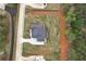 Aerial showing lot and landscaping with a long driveway and wooded boundary at 2107 E Maddox Rd, Buford, GA 30519