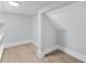 Unfinished attic space showcasing hardwood floors and neutral paint at 2107 E Maddox Rd, Buford, GA 30519