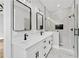 Elegant bathroom with double vanity, marble shower, and modern fixtures at 2107 E Maddox Rd, Buford, GA 30519
