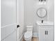 Modern powder room featuring white vanity, black hardware, and updated fixtures at 2107 E Maddox Rd, Buford, GA 30519