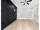 Bedroom featuring custom geometric accent wall and modern doors leading to other rooms at 2107 E Maddox Rd, Buford, GA 30519