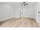Bedroom with hardwood flooring, ceiling fan and ensuite bathroom at 2107 E Maddox Rd, Buford, GA 30519