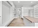Large walk-in closet with an island, open shelving, and a view into a bedroom at 2107 E Maddox Rd, Buford, GA 30519