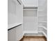 Walk-in closet with custom shelving and ample hanging space, ready for organization at 2107 E Maddox Rd, Buford, GA 30519