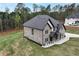 Beautiful exterior with brick and siding, lush lawn, and a concrete driveway at 2107 E Maddox Rd, Buford, GA 30519