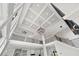 The foyer features high ceilings, a modern chandelier, and an overlook from the second floor at 2107 E Maddox Rd, Buford, GA 30519