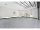 Spacious garage with utility sink, built-in shelving, and epoxy flooring, designed for convenience and organization at 2107 E Maddox Rd, Buford, GA 30519