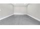Large garage with epoxy flooring and ample space, offering a clean and functional area for vehicles and storage at 2107 E Maddox Rd, Buford, GA 30519