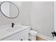 Stylish half bathroom with sleek vanity, modern fixtures, and minimalist design elements at 2107 E Maddox Rd, Buford, GA 30519