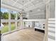 Bright living room with soaring ceilings, modern chandelier, and open floor plan to kitchen and dining areas at 2107 E Maddox Rd, Buford, GA 30519