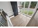 Overhead view of an open living area with fireplace, built-in shelving and a wall of bright windows at 2107 E Maddox Rd, Buford, GA 30519