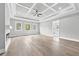 Spacious main bedroom with tray ceiling, fireplace, and hardwood floors, perfect for relaxation and comfort at 2107 E Maddox Rd, Buford, GA 30519
