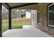 Spacious covered patio overlooking the backyard, providing a serene outdoor living space at 2107 E Maddox Rd, Buford, GA 30519