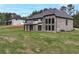 Brick and stone exterior with black trim accents, plus large, grassy yard at 2107 E Maddox Rd, Buford, GA 30519