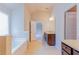 Primary bathroom with tile floors, double vanity and soaking tub at 2396 Bear Mountain St, Lithonia, GA 30058