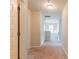 Upstairs hallway with neutral carpet and multiple doors at 2396 Bear Mountain St, Lithonia, GA 30058