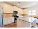 Bright kitchen with stainless steel appliances, granite countertops and white cabinetry at 2396 Bear Mountain St, Lithonia, GA 30058