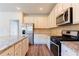 Gourmet kitchen boasts granite countertops, stainless steel appliances, and ample counter space at 2396 Bear Mountain St, Lithonia, GA 30058
