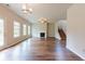 Spacious living area featuring hardwood floors, abundant natural light, and a cozy fireplace at 2396 Bear Mountain St, Lithonia, GA 30058