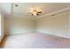 Expansive main bedroom has tray ceiling, neutral carpet and a ceiling fan at 2396 Bear Mountain St, Lithonia, GA 30058