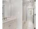 Bathroom features white cabinets, sink, bathtub, and tile floors at 295 Langshire Dr, Mcdonough, GA 30253