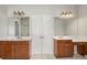Bathroom featuring double vanities, granite counters, and a large mirror at 295 Langshire Dr, Mcdonough, GA 30253