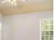 Bright bedroom with white walls, ceiling fan, and a window view of the outdoors at 295 Langshire Dr, Mcdonough, GA 30253