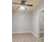 A simple bedroom with tile floors and light walls, and a ceiling fan for comfort at 295 Langshire Dr, Mcdonough, GA 30253