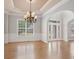 Open foyer with hardwood floors, decorative molding, and grand entry doors at 295 Langshire Dr, Mcdonough, GA 30253