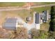 Scenic aerial view of a modern home, barn, and shed on a sprawling lot with mature trees and manicured lawns at 111 Ayers Driver Rd, Villa Rica, GA 30180