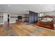 Large basement area with unique flooring, separate workout space and curtained bedroom area at 111 Ayers Driver Rd, Villa Rica, GA 30180