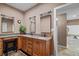 Well-lit bathroom with double sinks, granite countertops, and wood cabinets at 111 Ayers Driver Rd, Villa Rica, GA 30180