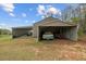 Carport providing sheltered parking for multiple vehicles, with additional storage space at 111 Ayers Driver Rd, Villa Rica, GA 30180