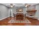 Stylish dining room with a fireplace, hardwood flooring, and ample seating at 111 Ayers Driver Rd, Villa Rica, GA 30180