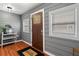 Inviting entryway with wood-look floors, a decorative door, and neutral-toned walls at 111 Ayers Driver Rd, Villa Rica, GA 30180