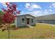 Charming exterior view of a compact home with a ramp and manicured lawn at 111 Ayers Driver Rd, Villa Rica, GA 30180