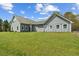 A view of the home's exterior featuring expansive front yard and metal roof at 111 Ayers Driver Rd, Villa Rica, GA 30180