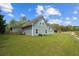 Exterior view of home with large yard, showing back and side elevations at 111 Ayers Driver Rd, Villa Rica, GA 30180